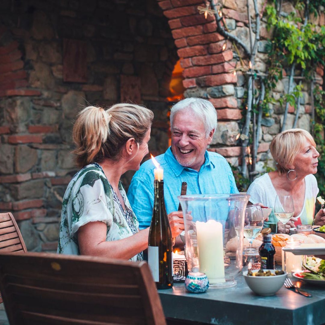 People sat at table al fresco dining